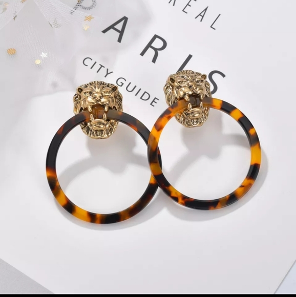 Italian designer inspired lion head hoop earrings. New in original package